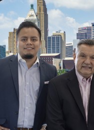 Ruben and Eleazar Contreras of The Contreras Team in front of the Cincinnati skyline